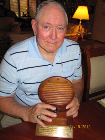 Jim pushing the John Glenn button just before it was donated to a NASA museum. The trophy was donated by T.J.s wife Anne after his passing in 2009.